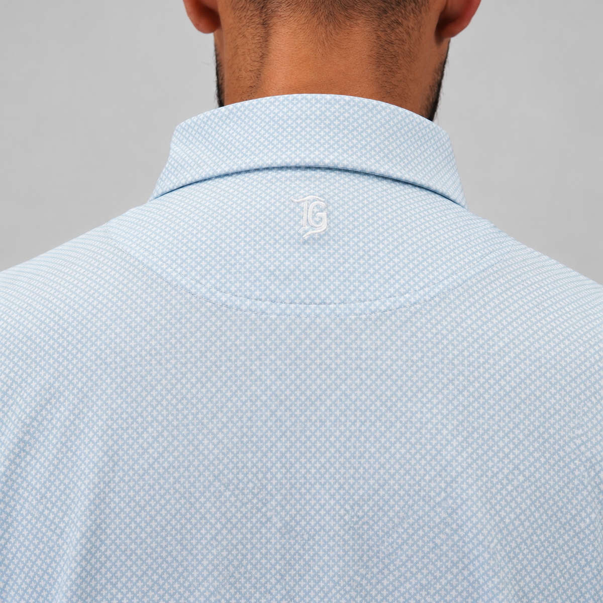 Trash Golf Polo in Aqua Geo, back